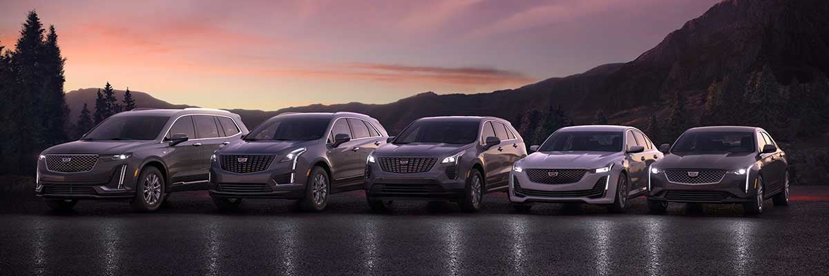 Sunset in the mountains with 5 new Cadillac's